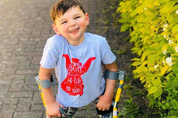 Tony Hudgell, 5, raises £1m with 10km walk on prosthetic legs